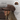 Brown cap with quality 3D embroidery and adjustable leather strap worn by a woman, with close-up inset.