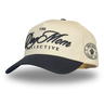 Beige and black cap with 'The Dog Mom Collective' branding on a white background