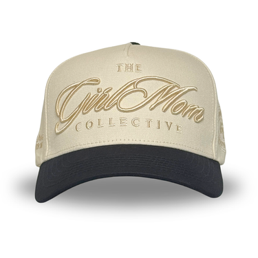 Beige and black cap with 'The Girl Mom Collective' logo on a white background