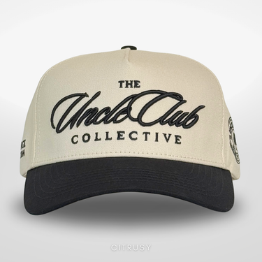 Beige and black cap with 'The Uncle Club Collective' logo on a light gray background
