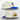 White cap with blue visor and red star designs on a light gray background