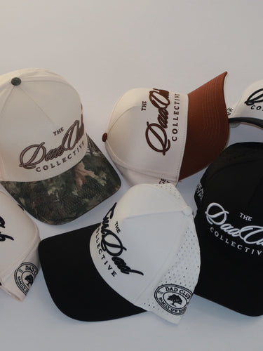 Collection of hats with 'The Dad Club Collective' logo on a white background